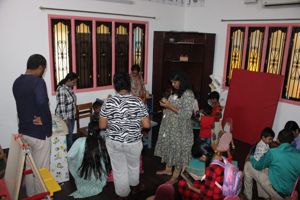 A cheerful group of parents gathered together, participating in a playschool event.